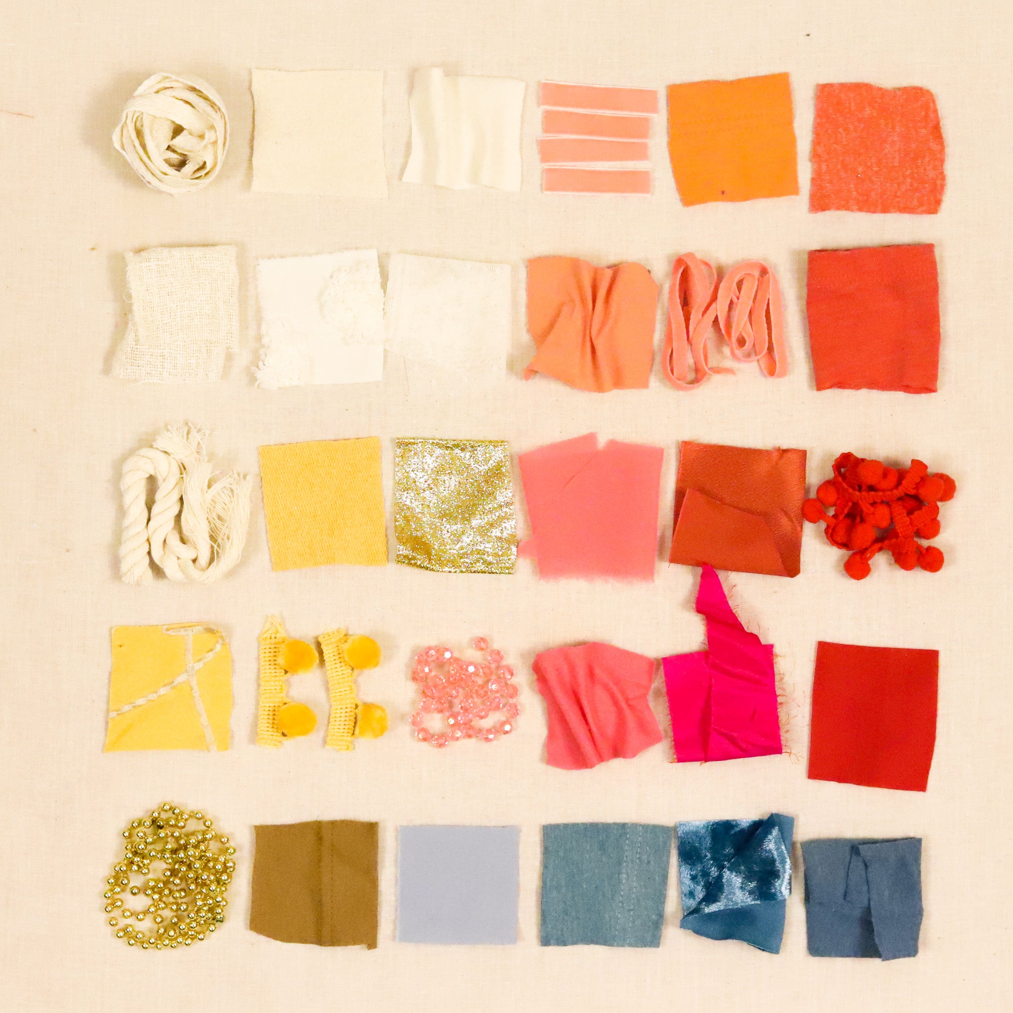 Collection of fabric swatches in various colors on a beige background
